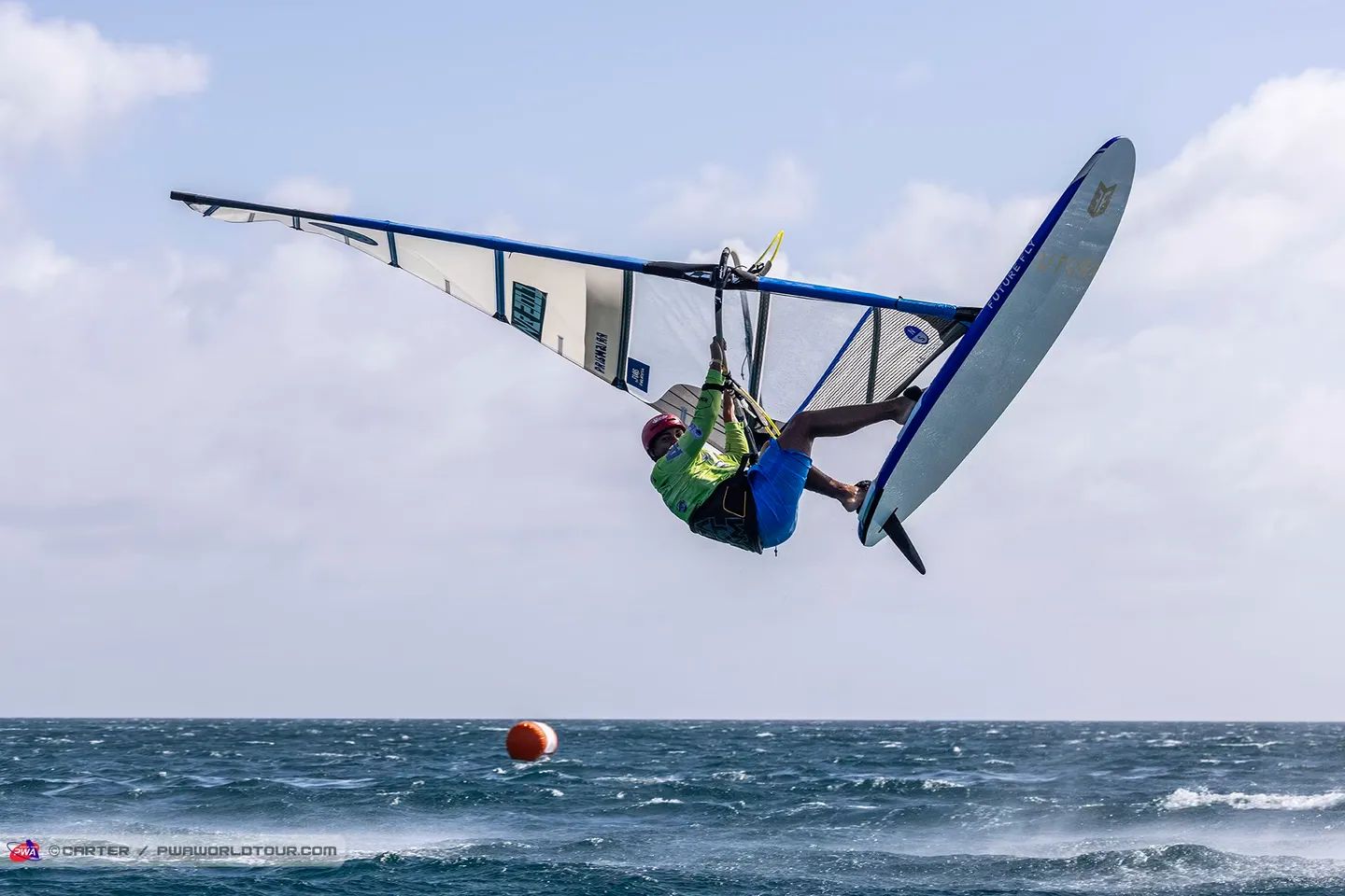 Windsurfer airborne mid-jump
